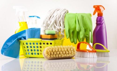 Local upholstery cleaner treating a fabric sofa in Camden